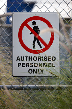 Authorised personnel sign on fence