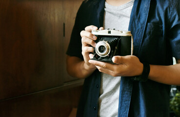photographer hold vintage camera