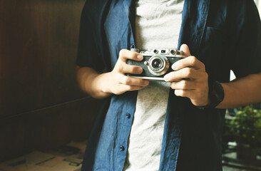 photographer hold vintage camera