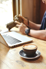 cup of coffee with art of late