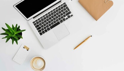 An overhead view of a white desk workspace setup