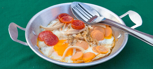 pan-fried egg with pork and toppings. Breakfast food in Thai style