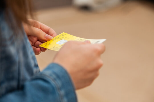 Woman holding a ticket for train ride