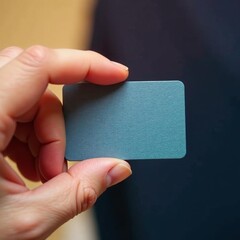 Close-up of a hand holding a professional business card, business, marketing, communication