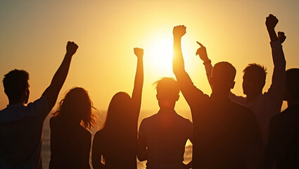 Fototapeta premium Raised Fists in Sunlight: A Powerful Symbol of Teamwork, Competition, and Unity for Achieving Common Goals - Photo Stock Concept with Space for Text on the Left