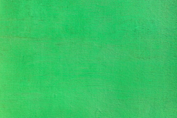 painted bright green sheet of plywood. high-detailed textured background.