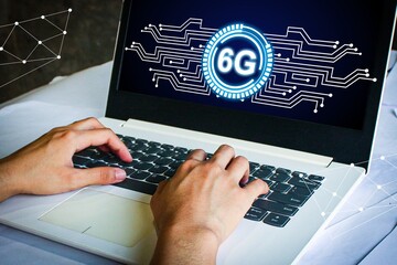person using a laptop with a futuristic 6G network interface. Digital connection, fast internet, and technology concept with glowing elements. Ideal for business, innovation, and communication.