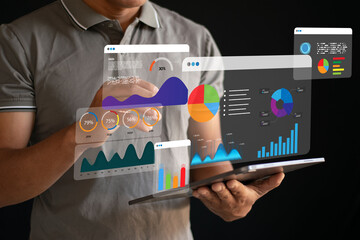 Analysts use laptops and technology for business data analysis, data collection for reporting, and digital marketing.