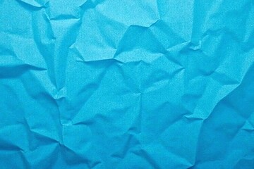 Obraz premium Close up of wrinkled blue paper creating a textured background, copy space, empty, close-up