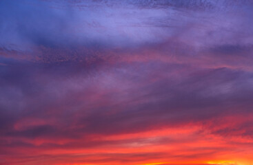 Stunning dramatic sunset sky with purple clouds and pink and red firmament texture banner