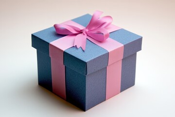 Obraz premium A square gift box is decorated with a pink ribbon and bow