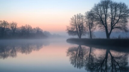 Fototapeta premium Misty Dawn Reflection: Serene Lake and Treescape at Sunrise