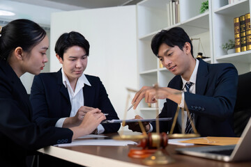 Legal Documentation Review and Collaboration. Lawyers working together to analyze legal contracts.