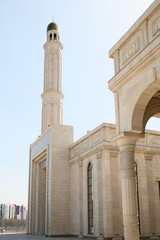 Elegant Mosque with Minaret and Arches Under Clear Sky