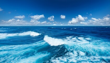 Fototapeta premium a blue ocean with white waves