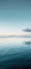 Obraz premium Calm waters under a serene blue sky