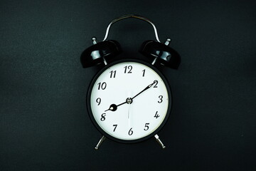 Alarm clock with space copy for text message on black background