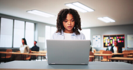 Student Girl In Classroom Using Laptop