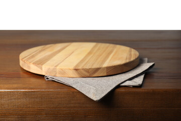 Gray napkin and empty board on wooden table against white background