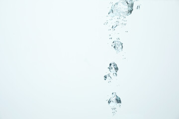 Many water bubbles on light background, closeup. Space for text