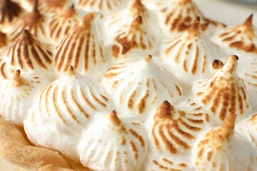 Delicious pie with browned meringue, closeup view