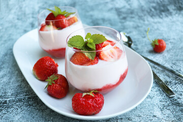 Strawberry summer layered dessert with whipped cream. Cream cheese with fresh strawberry.
