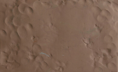 Brown plasticine texture background. Modeling clay material pattern.