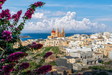 Stunning coastal views and Mediterranean charm, with beauty of Mellieha Parish Church in Malta....