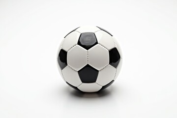 Fototapeta premium A single football sits on a plain background