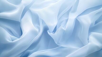 Obraz premium Light blue fabric folds, close-up texture. Possible use textile backdrop or fashion
