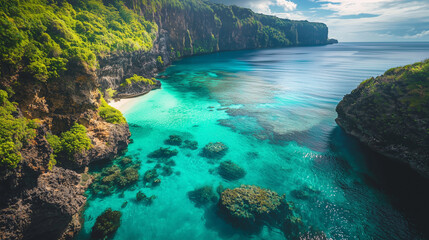 Drone shot over a cliffside overlooking a vibrant coral reef