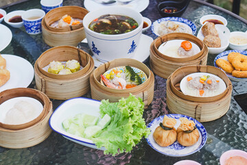Variety of dim sum dishes served in bamboo steamers, Asian cuisine
