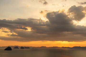 Dramatic sunset over islands and sea, golden hour landscape