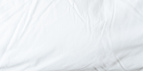 Fototapeta premium White bedsheet background, bed sheet texture, wrinkled duvet, crumpled satin blanket comforter cloth used in hotel, resort or home interior for bedding sleep comfort