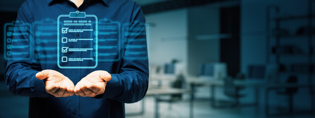 Businessman holding a holographic checklist icon in hands.
