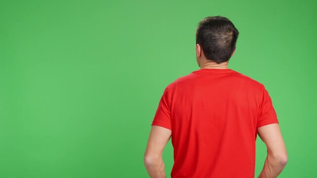 man with his back turned calmly contemplating something