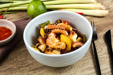 Roasted octopus with vegetables and oil