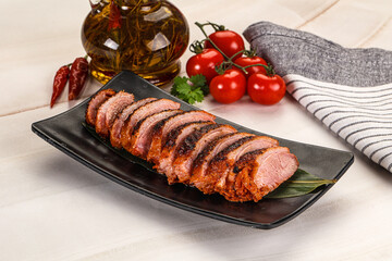 Sliced duck breast baked with cherry