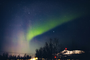 Aurora borealis, polar lights with Milky Way stars.