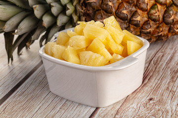 Sweet canned pineapple fruit pieces
