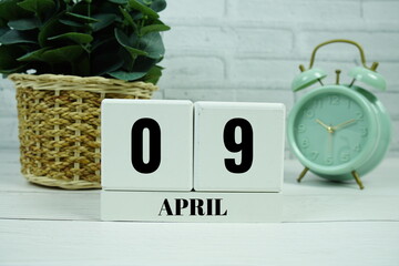 Wooden Calendar Showing the Date of April 9th. Day 9 of April month