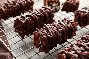 Delicious chocolate puffed rice bars on gray table, closeup