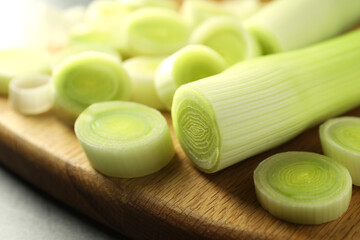Fresh cut leeks on grey table, closeup