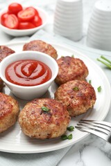 Delicious patties served on white table, closeup