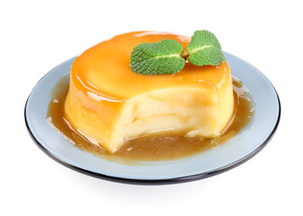 Delicious pudding with caramel sauce and mint isolated on white