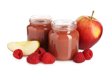 Baby food. Tasty puree in glass jars, fresh apples and raspberries isolated on white