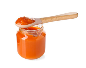 Baby food. Tasty puree in glass jar and spoon isolated on white