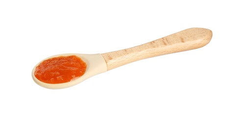Baby food. Spoon with tasty puree in air on white background