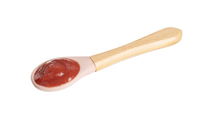 Baby food. Spoon with tasty puree in air on white background