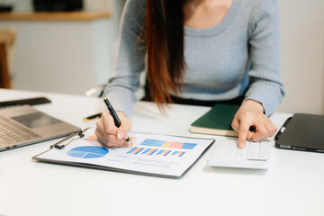 Businesswoman utilizing smartphone and tablet technology. Perfect for corporate, technology